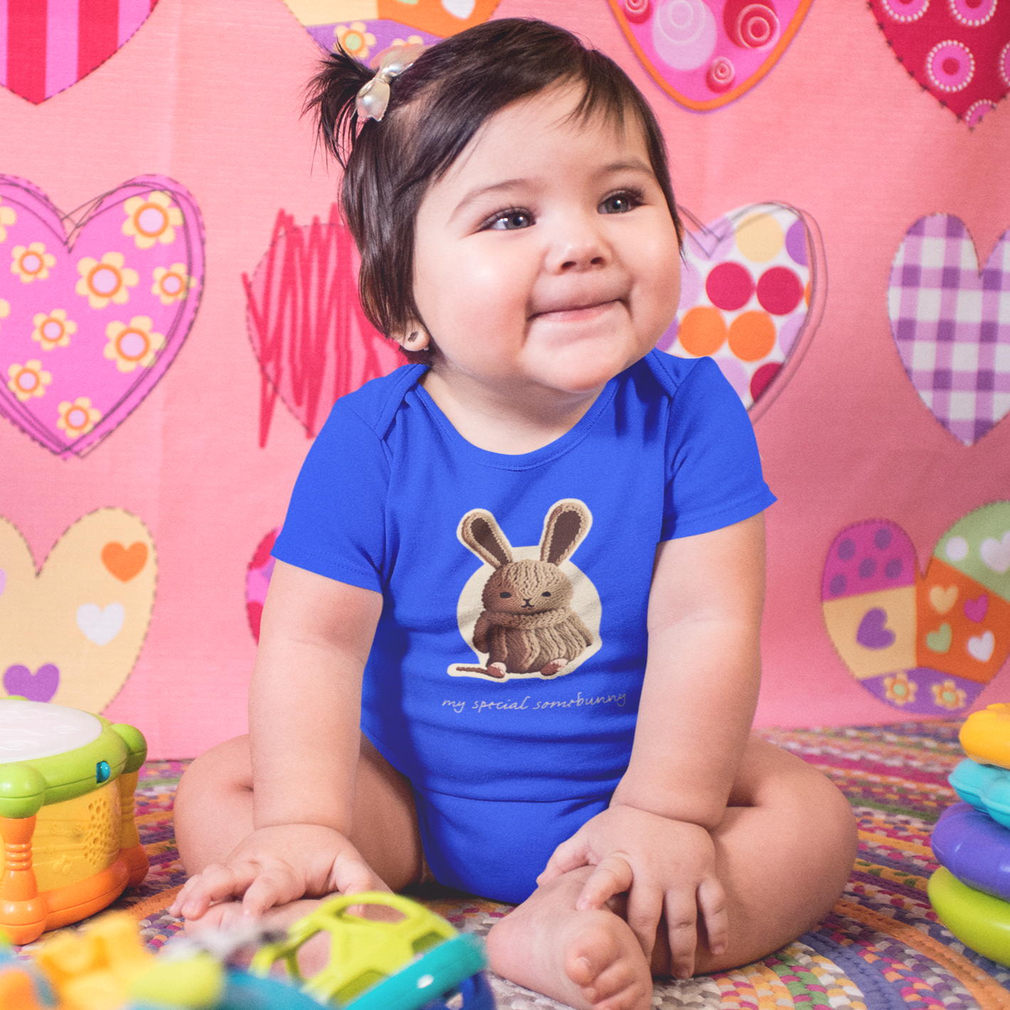 Adorable children's onesie from Whimsy Kids featuring a cute bunny design with the phrase 'My Special Somebunny.' Available in 8 delightful colors and 4 sizes. Perfect for your little one's wardrobe!